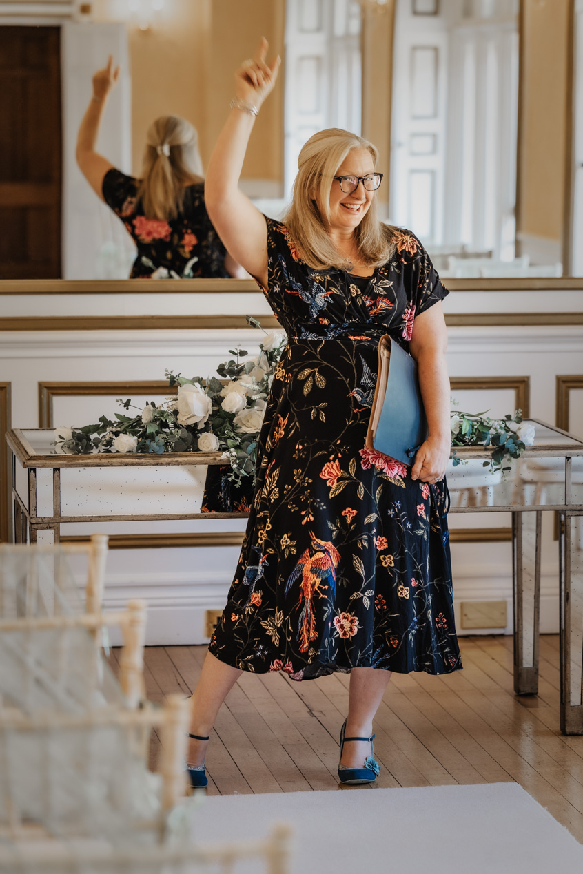 Deb Reed Celebrant based in Colchester Essex sitting smiling before a wedding.